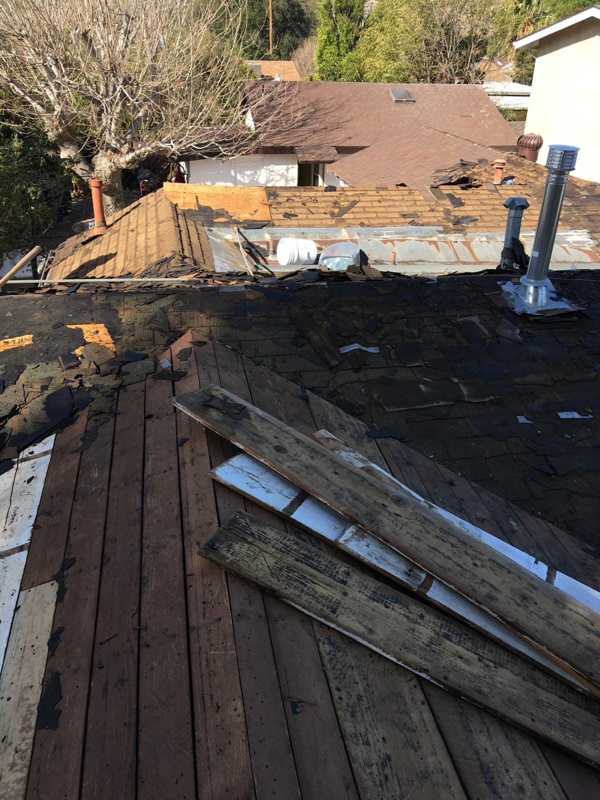 Old damaged residential roof before replacement